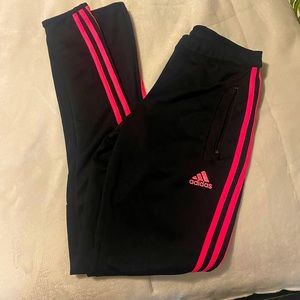 Pink and black Adidas climacool pants with zippered pockets.